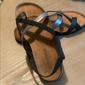 Makalu metallic and black criss cross sandals